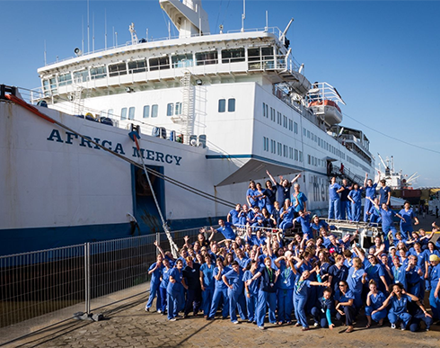 a group of people near a boat